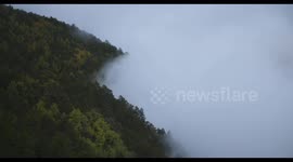 Aerial photography of the misty mountains on the plateau.