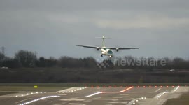 Scary! Diverted plane aborts landing then dips violently towards runway during 50mph Storm Pia winds at Birmingham Airport