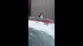Unique Chivalry Style Snowman on the Car Roof at Chinese Roadside