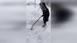 Car owners dig through 3ft deep snow that buried parked vehicles