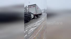 CHP Truckee Patrol Car Pushes Stranded Truck Through Icy Challenge on I-80 in California, USA