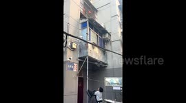 Young boy’s coat-catch saves cat dangling from rooftop