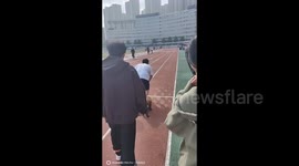 Adorable Dog Joins University Students’ Physical Test in Wuhan, Hubei, China