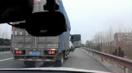 Drivers stop their cars on motorway to grab LIVE fish falling from truck