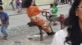 Woman uses gym machine in hilarious manner