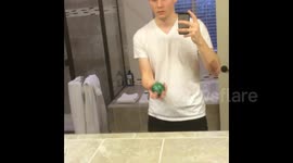 Man throws ball to himself through mirror in crazy optical illusion