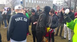 Protest in Iceland over Panama Papers. Kid hits Parliament Building with an egg.