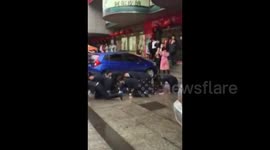 Chinese employees crawl along pavement after failing to achieve sales targets