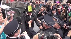 Scuffles as protesters force Tories from their vehicle in London