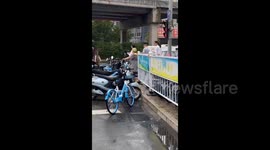 Woman Wearing a Watermelon Hat in Jinan, China