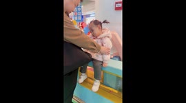 Cute girl awakes delightfully as find herself at amusement ground in China