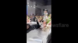 Bridesmaid in guise of cartoon character falls down at wedding in Shandong, China