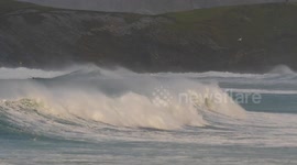 UK Weather. Stormy Britain continues into the New Year weekend. beach and sea goers play despite. Towan Beach, Newquay, Cornwall, UK