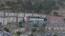 Pro Palestinian activists gather for prayers at Palestinian flag mural in Bo Kaap