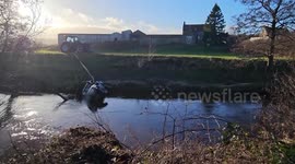 The vehicle is recovered from the river in Glaisdale, UK