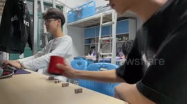 Man Makes Dice Rolling Trick with A Cup in Hefei, China