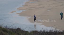 Storm sewage release at the popular beach of Crantock, Newquay, Cornwall, UK