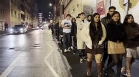 Huge queue forms outside club on New Years Eve as revellers eagerly wait in the rain and cold to get into a club to celebrate the new year - Nottingham, UK