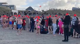 Dutch people dip in icy water to welcome New Year