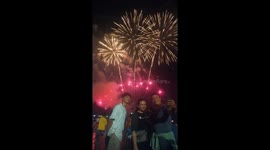 People enjoying fireworks show at Pattaya Thailand on December 31st 2023.