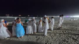 Rio de Janeiro, Brazil December 31, 2023. The origin of the traditional New Year's Eve party on the beaches of Brazil comes from African-based religions.