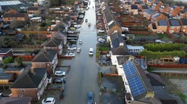 Families trapped in flooded homes after canal bursts its banks during Storm Henk