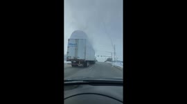Snow Covered Truck Takes out Traffic Light