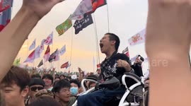 Chinese crowd lifts wheelchair-bound fan to new heights in heartwarming gesture at music festival