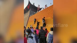 Parents criticised for making children steal oranges displayed as new year's decorations