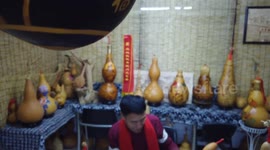 An Artist Makes A Pyrograph Dragon Gourd in Zhangjiakou, China