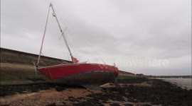 Yacht blown ashore by strong winds in Kent, UK