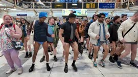 The No Trousers Ride commuters stop of to dance at Liverpool Street Station to be cheered on by a strange guy who highly respected what the No Trousers Riders was doing