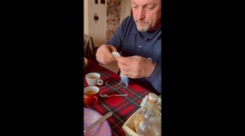 Lovebird Helps Open Sugar Packet