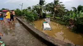 Tourists rescued from van when it falls into river in the Philippines