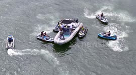 Military personnel from the Brazilian Navy board sports and recreational vessels to inspect documents at Praia do Morro in Guarapari - Brazil