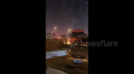 Firefighters Guard Beside Crowds Setting Off Fireworks on New Year's Eve in Lianyungang, China