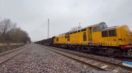 Class 37 locomotives taking the strain and pulling how many tons of logs via rail, Newtown Powys.