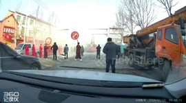 Overhead door frame collapses on crane after boom collision in China