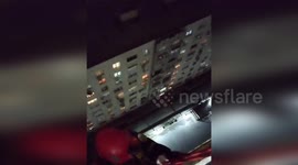 Emergency Officer Hangs on Rope Over Balcony to Save Child in Baku, Azerbaijan