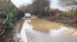'We're trapped in our tiny village by 90 potholes and flooded roads - we just want the council to fix them'