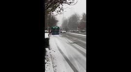 Mercedez Benz car swerves off slippery snow-covered road in China