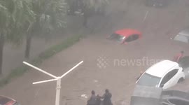 Cyclone Belal: Locals sit atop vehicles as flooding sweeps cars along road in Mauritius