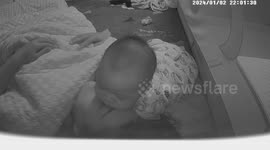 Baby persistently sleeping on mothers head at night in Shandong, China