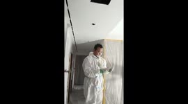 Clumsy painter hit by falling plaster and has white face