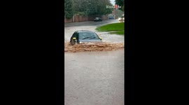 Woman proves to be her own car's biggest enemy by deliberately driving into floodwater