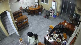 Heartwarming moment albino toddler joins parents in restaurant cleanup in China