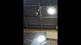 Innovative Chinese man uses drone to install light bulb