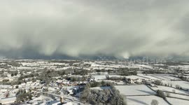 Drone footage of 'snow curtains' sweeping across sky above Northern Ireland