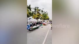 Strong winds batter bay walk street vendor tents