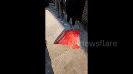 Red metal plummets from sky, damaging cars and buildings in southern China